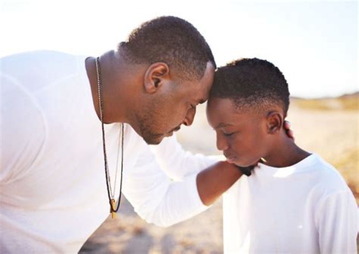 Jakobi with his father and siblings
