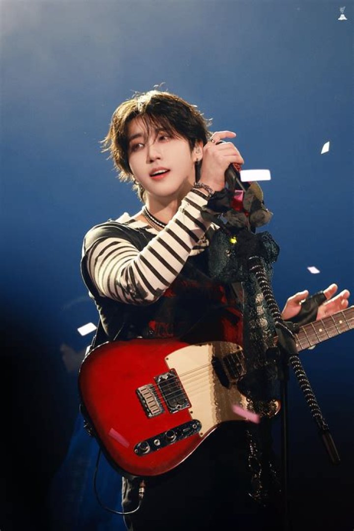 Sam Kim with his guitar